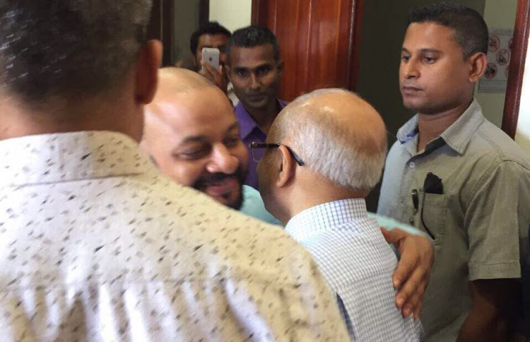 Dhiggaru MP Faris Maumoon with his father, former president Maumoon Abdul Gayoom, after the MP's trial at the Criminal Court. PHOTO / MIHAARU
