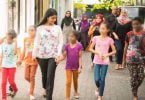 Gender Minister Aminath Zeneesha Shaheed Zaki pictured with some children, heading to the recently opened Schwack Cinema in Hulhumale. PHOTO/GENDER MINISTRY