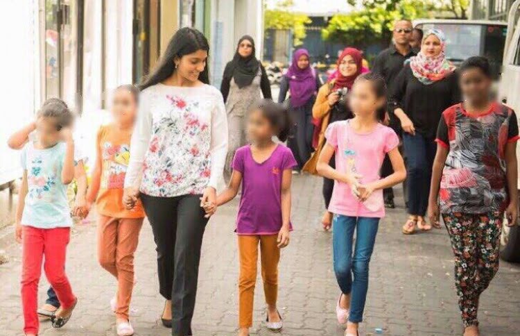 Gender Minister Aminath Zeneesha Shaheed Zaki pictured with some children, heading to the recently opened Schwack Cinema in Hulhumale. PHOTO/GENDER MINISTRY