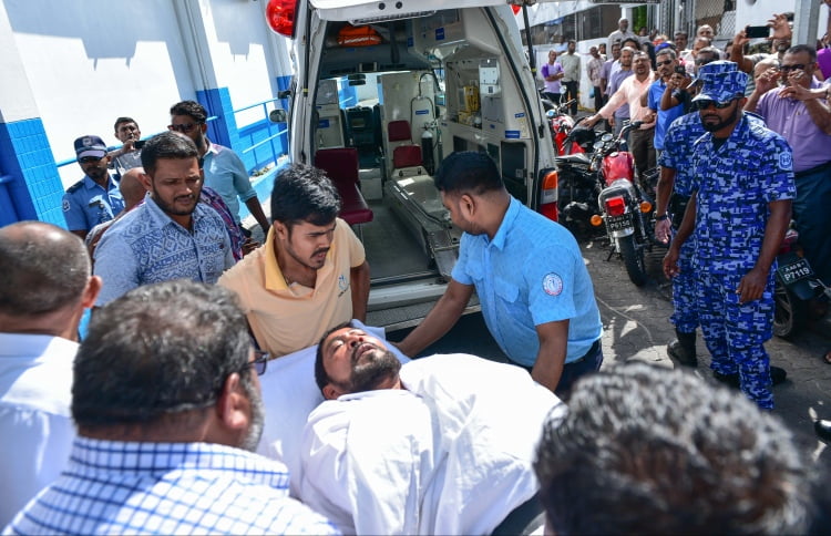 Maamigili MP Qasim Ibrahim carried out from the Criminal Court on a stretcher to the ambulance after he fainted during his hearing. PHOTO: HUSSAIN WAHEED/MIHAARU