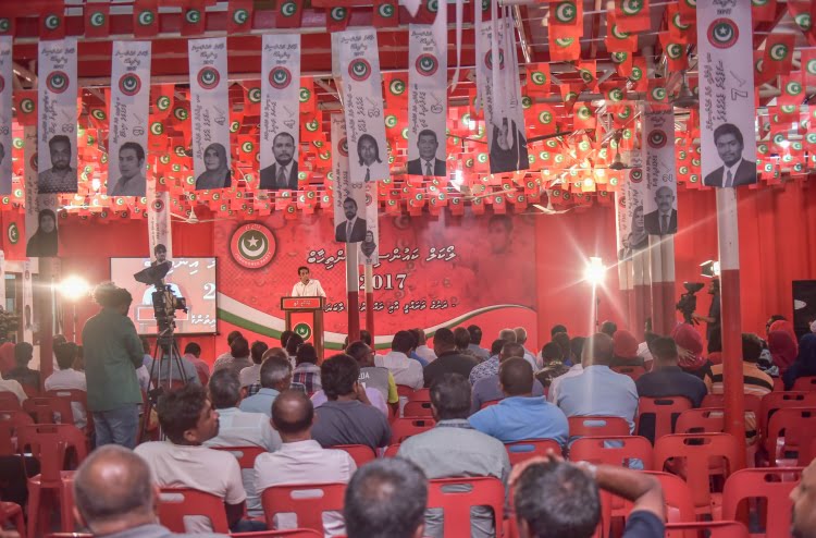 Jumhoory Party's flags and logo pictured at a party rally. PHOTO/MIHAARU