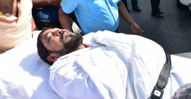 Maamigili MP Qasim Ibrahim carried out from the Criminal Court on a stretcher to the ambulance after he fainted during his hearing. PHOTO: HUSSAIN WAHEED/MIHAARU