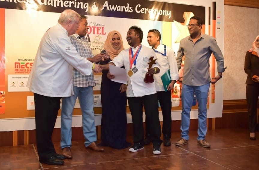 Chef Fatheen receiving the trophy at the culinary challenge