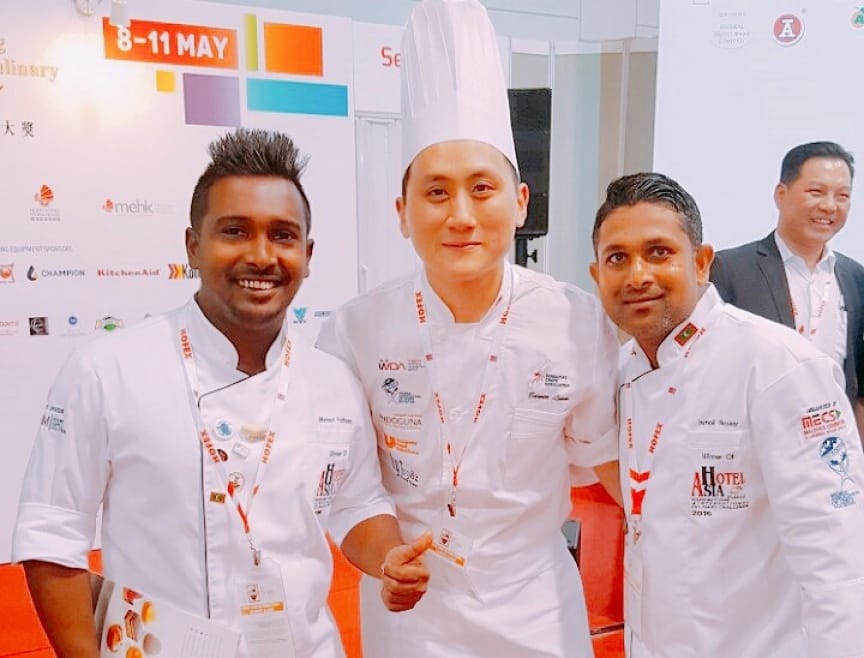 Chef Fatheen with other chefs in a competition