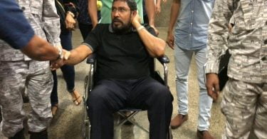 Opposition Jumhoory Party (JP) leader Qasim Ibrahim being taken to Velana International Airport (VIA) by Maldives Correctional Service (MCS) officers. He was given permission to depart to Singapore on Wednesday evening.