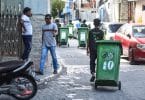 A waste collector from Waste Management Corporation (WAMCO) taking trash out of a house in the capital Male. PHOTO / MIHAARU