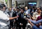 Lawyers speak to press after presenting a "great, big" Constitution to the Attorney General.