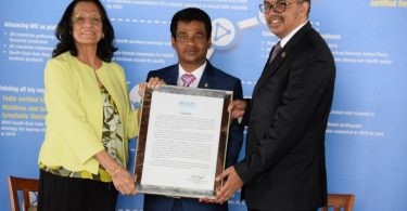 Health Minister Abdulla Nazim Ibrahim (C) receives WHO's award to the Maldives for the successful eradication of measles from the country. PHOTO/HEALTH MINISTRY