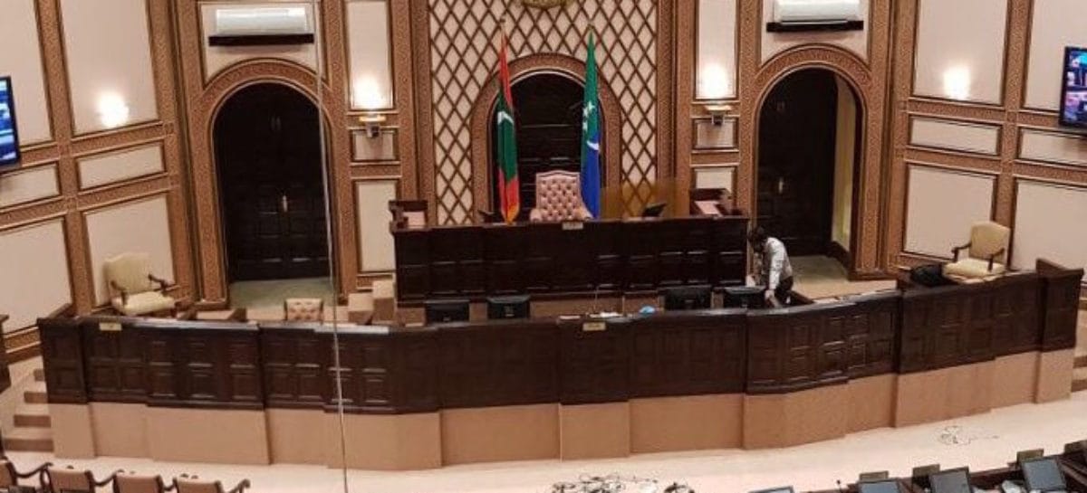 Majlis continues over din of opposition protest