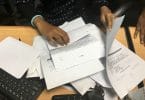 A housing ministry worker handles complaints submitted by the public regarding flat distribution of the government's first social housing project. PHOTO: NISHAN ALI/MIHAARU