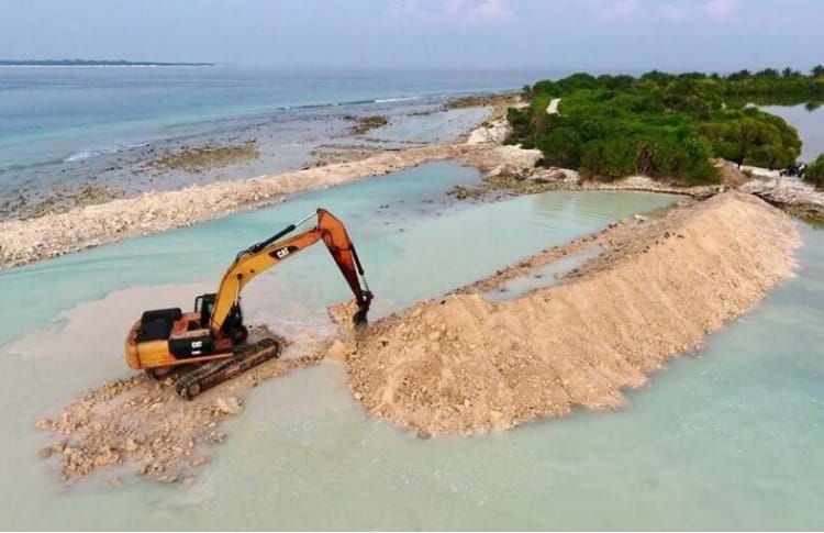 Developing the bund wall around the area to be reclaimed in HDh. Kulhudhuffushi's mangrove swamp. PHOTO/SOCIAL MEDIA