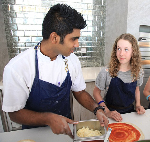 Alice learns to make a pizza at one of the classes at the resort. The family also had high tea in the Deli – known as K Tea