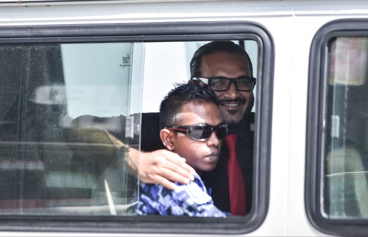 Ex-VP Ahmed Adheeb pictured inside a police vehicle as he is escorted back to Dhoonidhoo detention centre after his preliminary hearing at the Criminal Court. PHOTO: HUSSAIN WAHEED/MIHAARU