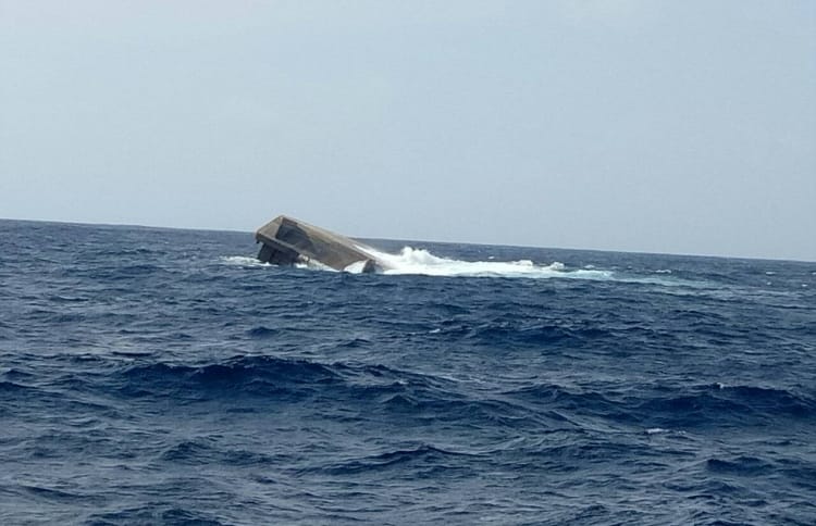 The barge "Kurimagu" of MTCC, carrying 3,300 tonnes of aggregate to HDh Kulhudhuffushi, capsized after it was caught in a storm. PHOTO/READER