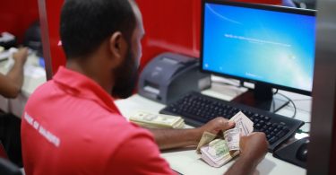 BML employee counting US dollars