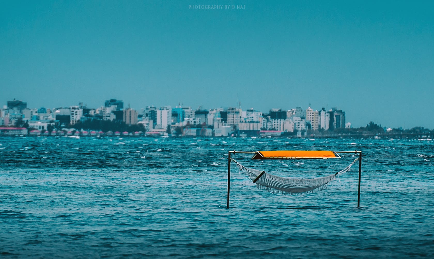 Rising sea levels threaten to sink the low-lying islands by the end of the century. 