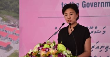 Counsellor Yang Yin of the Chinese Embassy speaks at the ceremony in which CMEC handed over 1,500 flats to the Maldivian government. PHOTO: HUSSAIN WAHEED/MIHAARU