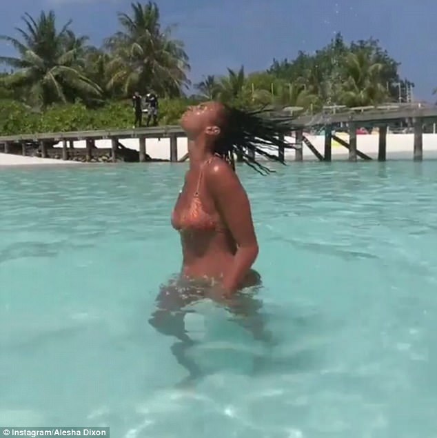 'I whip my hair back and forth': Another sultry clip shows the Boy Does Nothing hitmaker whip her hair back while enjoying a dip in the azure ocean