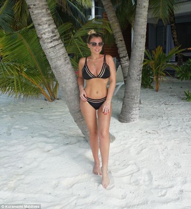 Life's a beach! In another stunning shot, the mother-of-two donned a black bikini that offered a look at her impeccably toned abs as she posed up a storm on the beach