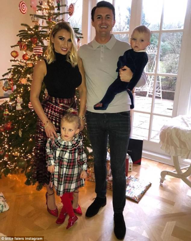 Happy families: Billie is on holiday with her fiance Greg Shepherd and their children, Nelly, three, and Arthur, 10 months (pictured at home for Christmas)