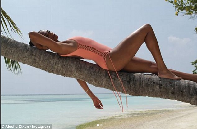 Full relaxation mode! Taking to Instagram, the singer commanded attention in an alluring swimsuit as she struck a series of eye-catching poses on a palm tree, before taking to the scenic ocean