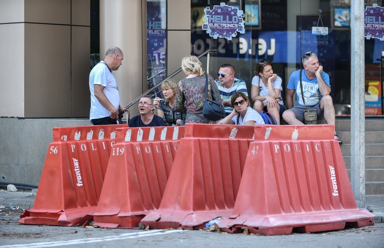 tourists at a police blockade