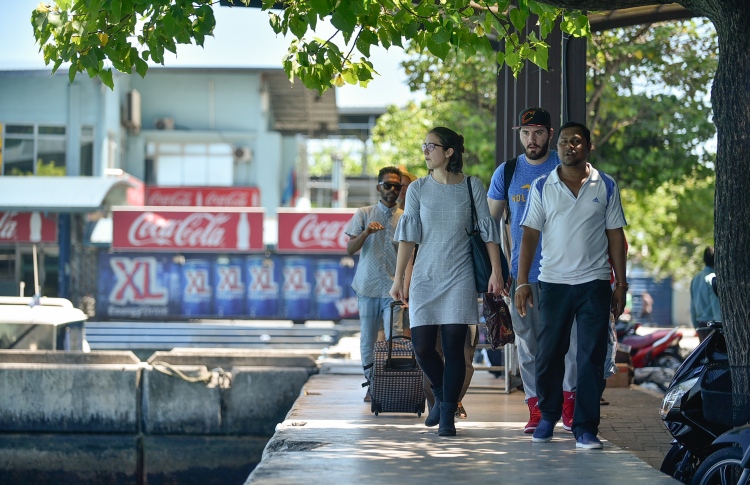 tourists at the airport ferry jetty