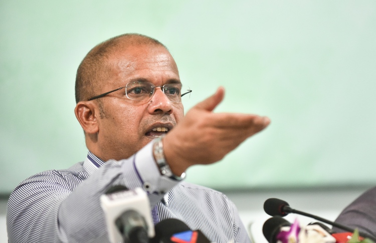 Shareef speaking at a news conference