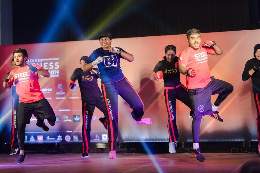 In the middle – Dhafeena Hassan Ibrahim, A Personal Trainer.